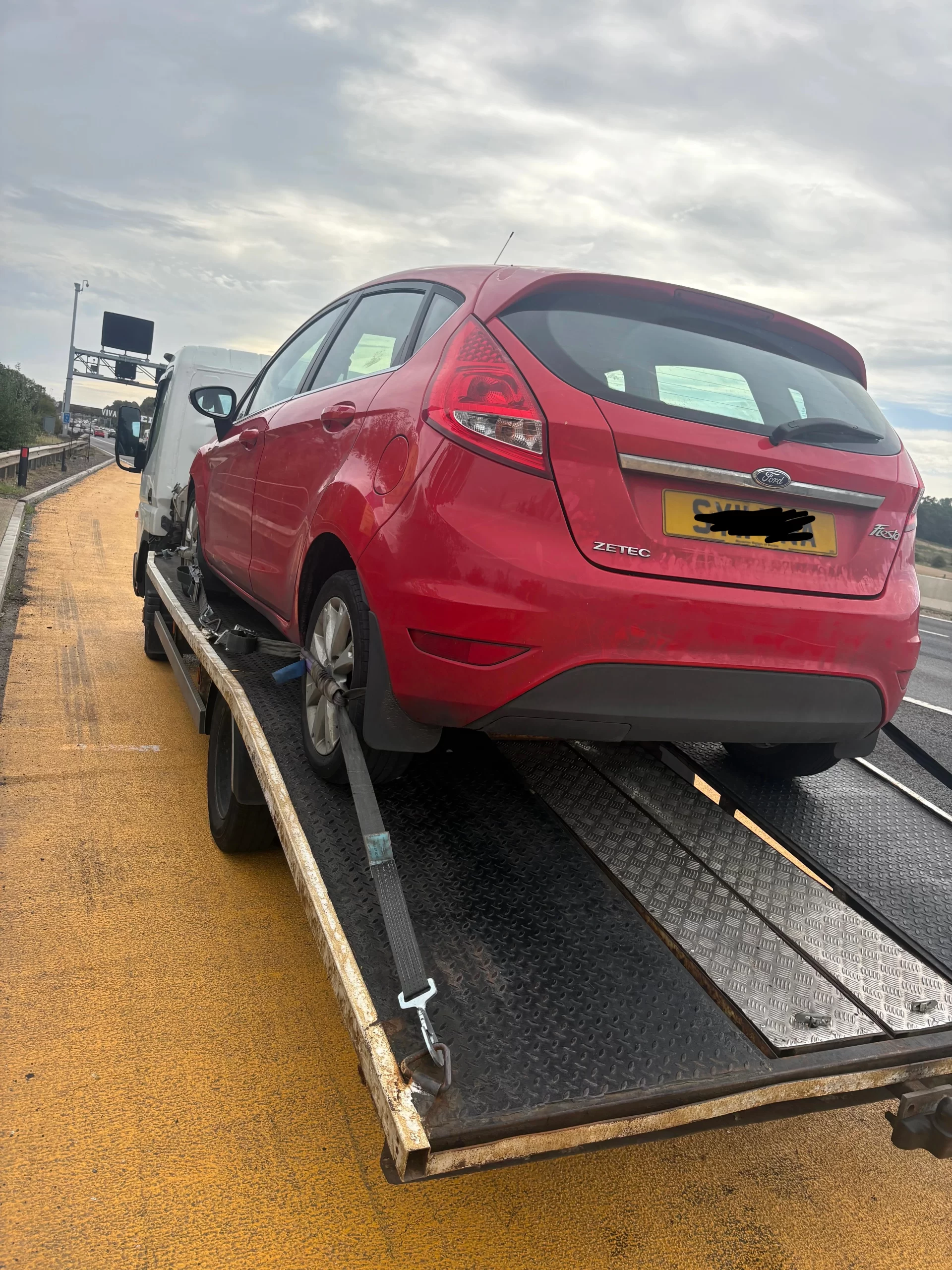 Vehicle loaded for recovery and delivery to an agreed destination